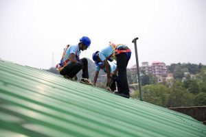 Roofing-Maintenance-DynaRoof-drilling